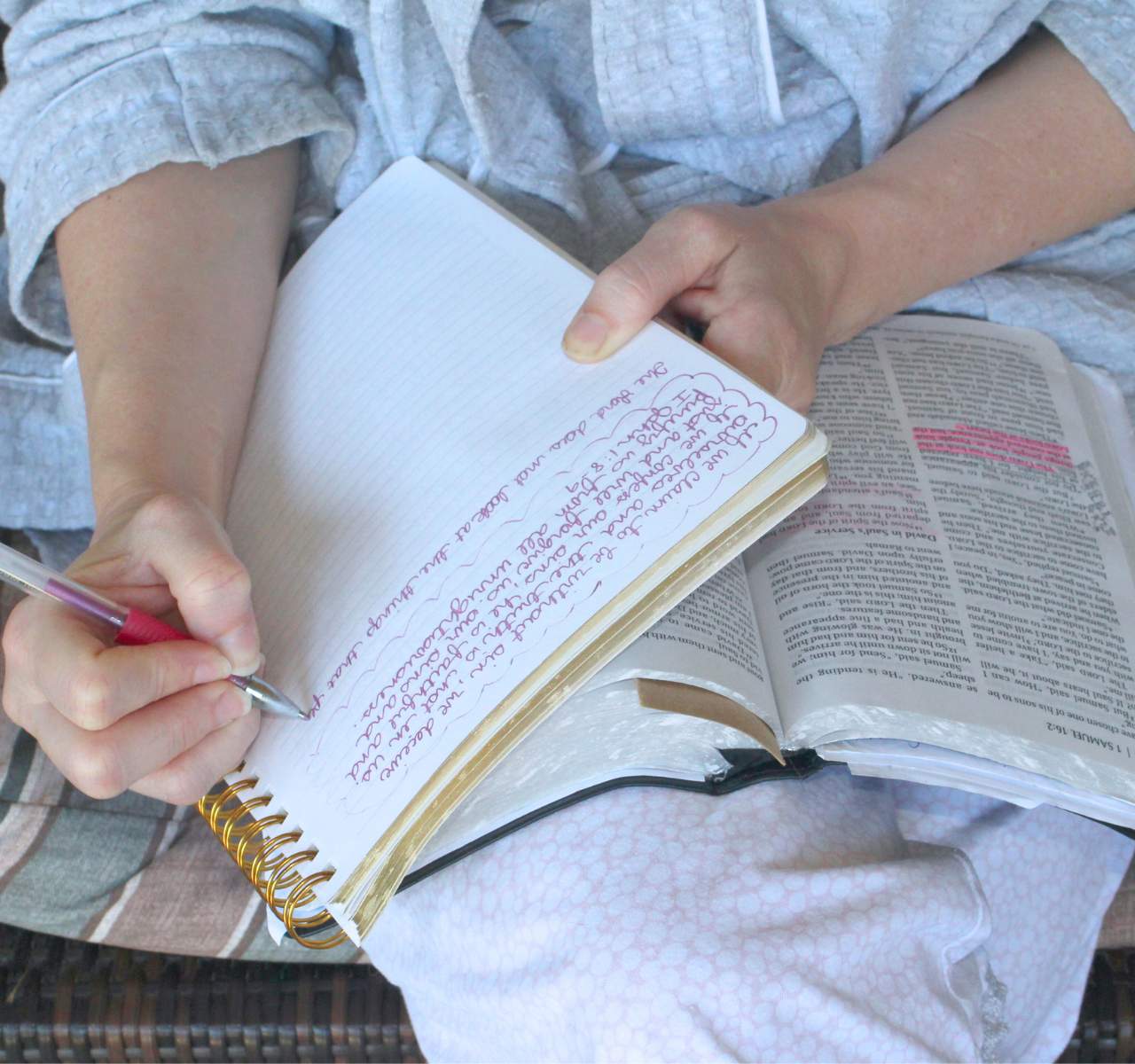 Woman reading the Bible and taking notes